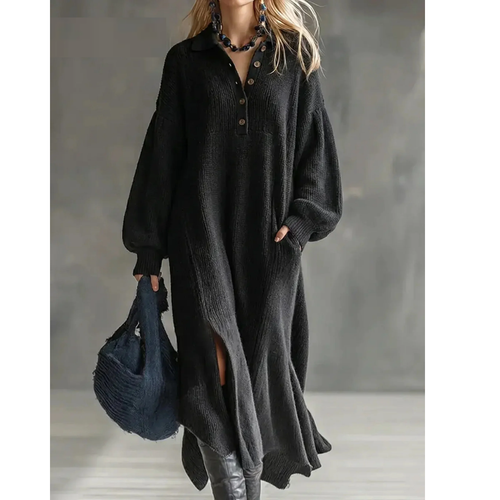 Woman wearing a relaxed ribbed knit jumper dress with polo collar, button placket and balloon sleeves