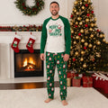 Christmas pajama set with Merry and Bright raglan tee and green Santa print pants worn by family - view 4