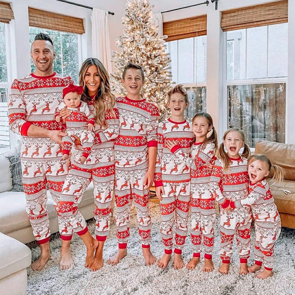 Family matching Christmas pyjamas in red and white reindeer and snowflake print - view 2