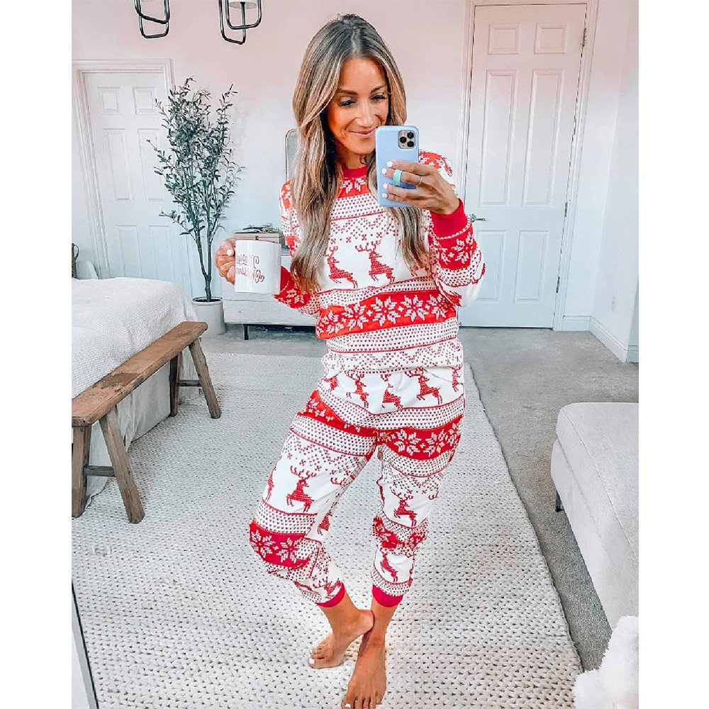 Family matching Christmas pyjamas in red and white reindeer and snowflake print - view 6