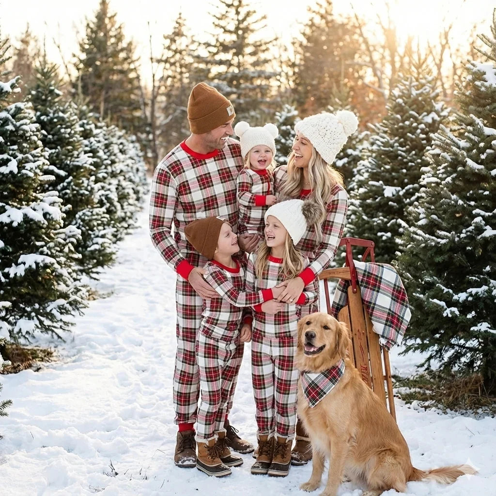 Family wearing matching cream and red tartan Christmas pyjamas with red ribbed cuffs - view 12