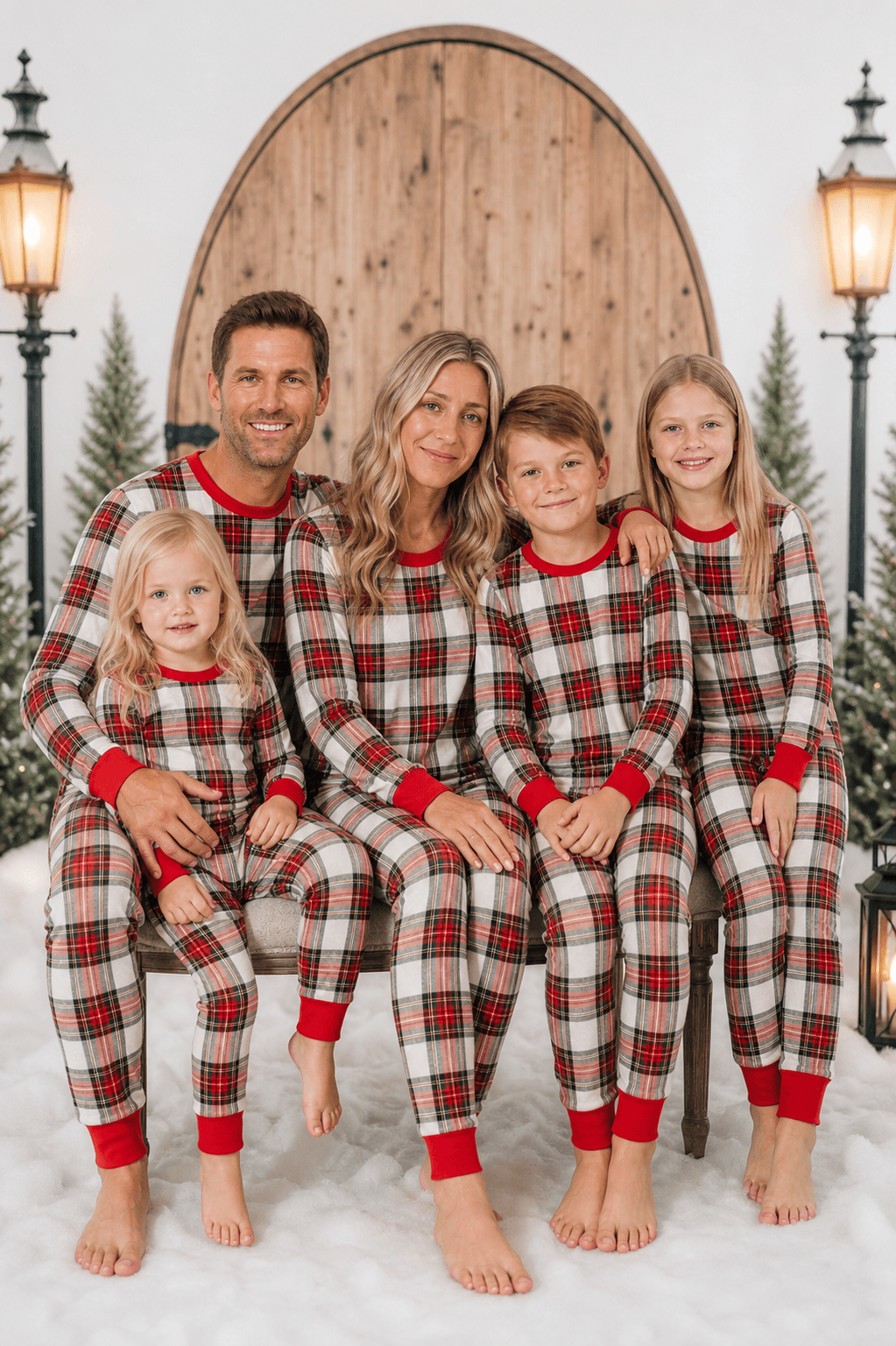 Family wearing matching cream and red tartan Christmas pyjamas with red ribbed cuffs - view 4