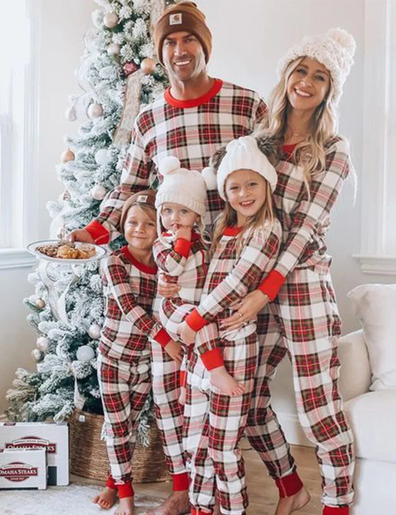 Family wearing matching cream and red tartan Christmas pyjamas with red ribbed cuffs - view 5