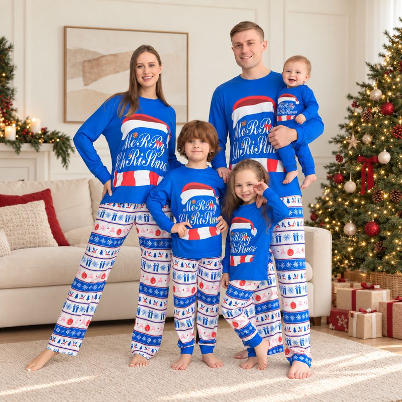 Couple in matching Christmas pajamas with blue Santa hat graphic top and patterned pants