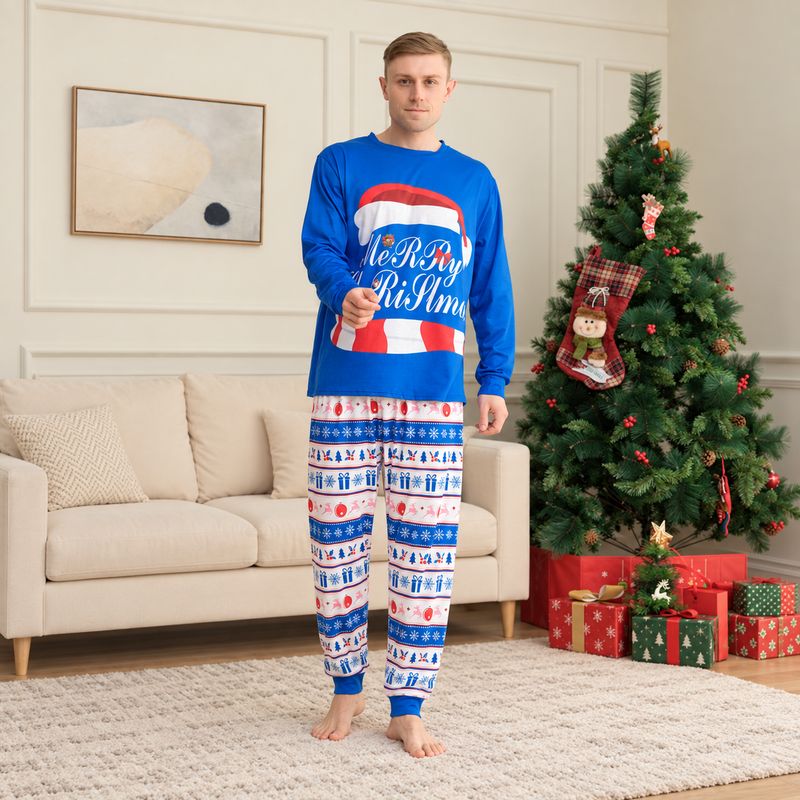 Couple in matching Christmas pajamas with blue Santa hat graphic top and patterned pants - view 3