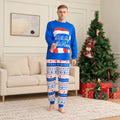 Couple in matching Christmas pajamas with blue Santa hat graphic top and patterned pants - view 3