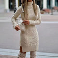 Woman wearing a fitted cable knit turtleneck sweater dress with side slit and knee-high boots - view 3