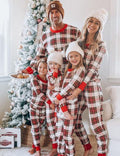 Matching family Christmas pyjamas in red and cream tartan check with red ribbed cuffs