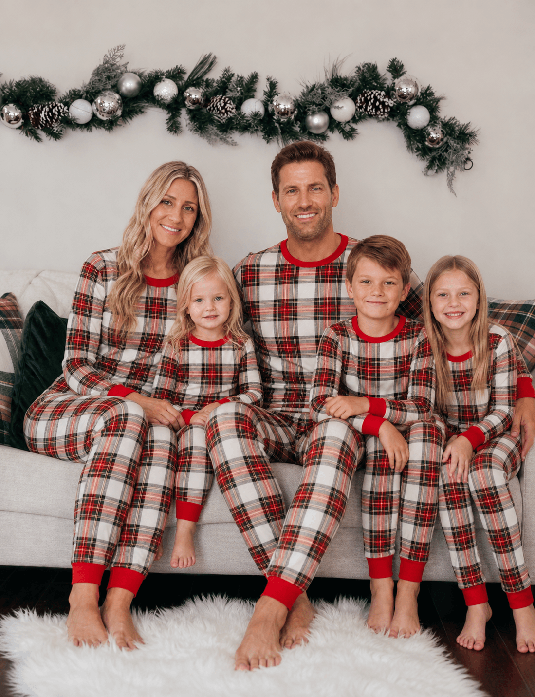 Matching family Christmas pyjamas in red and cream tartan check with red ribbed cuffs - view 5