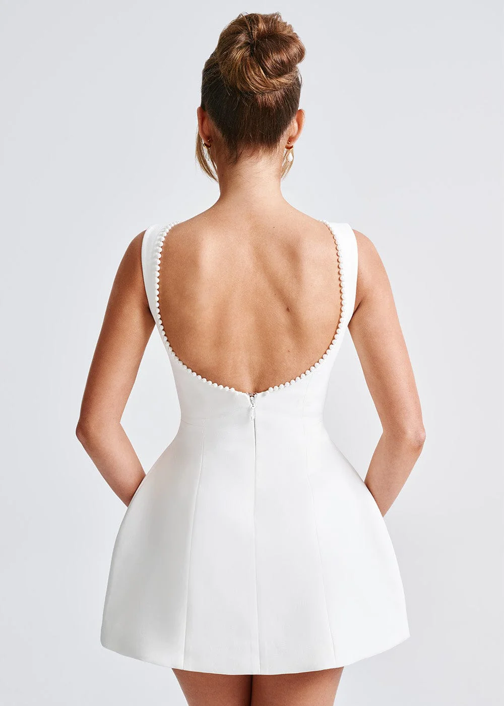 Sleeveless A-line mini dress with low scoop back and oversized pearl-trimmed bow - view 7