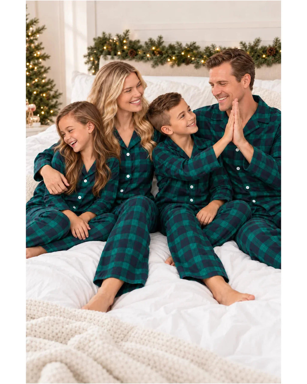 Family wearing matching green and navy tartan flannel Christmas pyjamas - view 6