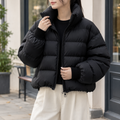 Women's cropped quilted puffer jacket with high stand collar and zip front