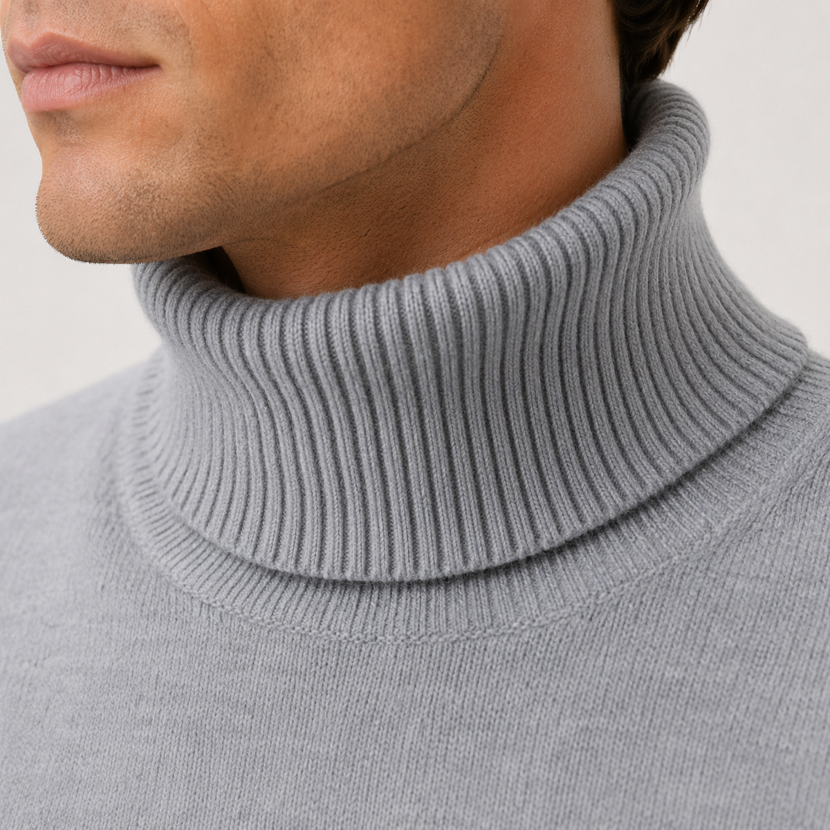 Man wearing a grey fine knit mens turtleneck jumper with ribbed collar and cuffs - view 3