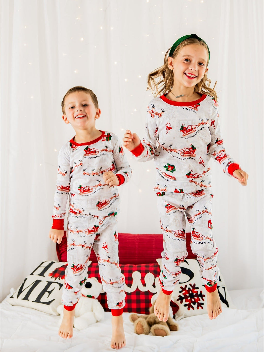 Matching family Christmas pyjamas with reindeer and Santa sleigh print and red ribbed trims - view 3