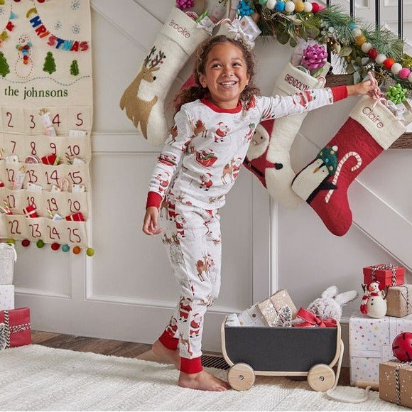 Matching family Christmas pyjamas with reindeer and Santa sleigh print and red ribbed trims - view 5