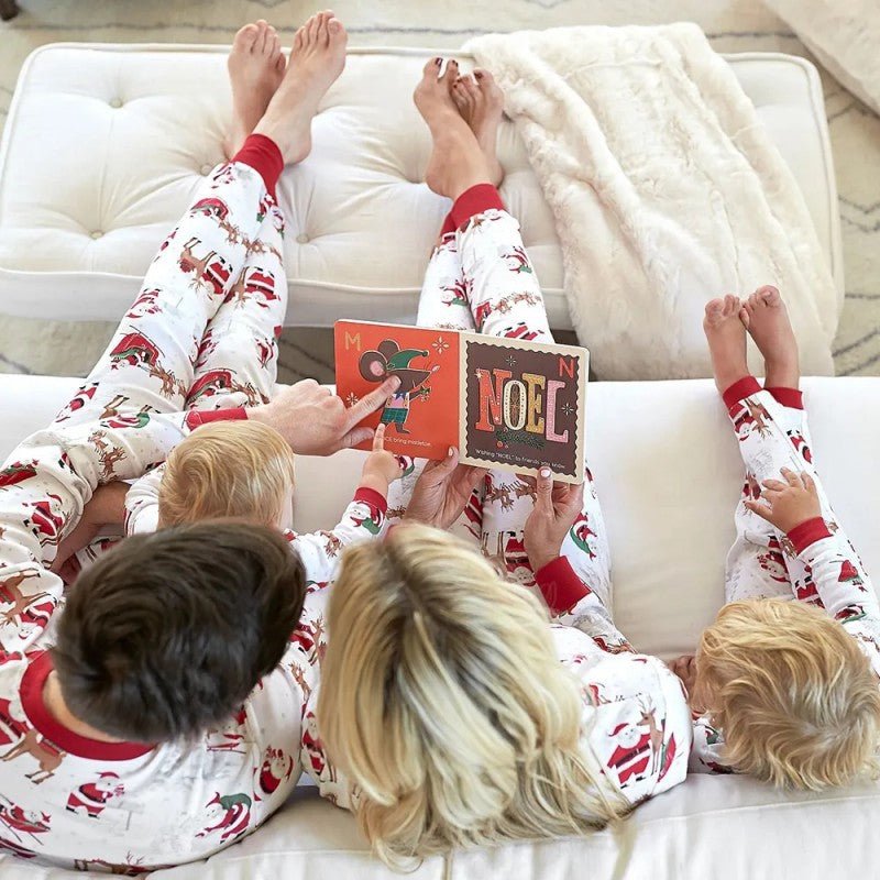 Matching family Christmas pyjamas with reindeer and Santa sleigh print and red ribbed trims - view 9