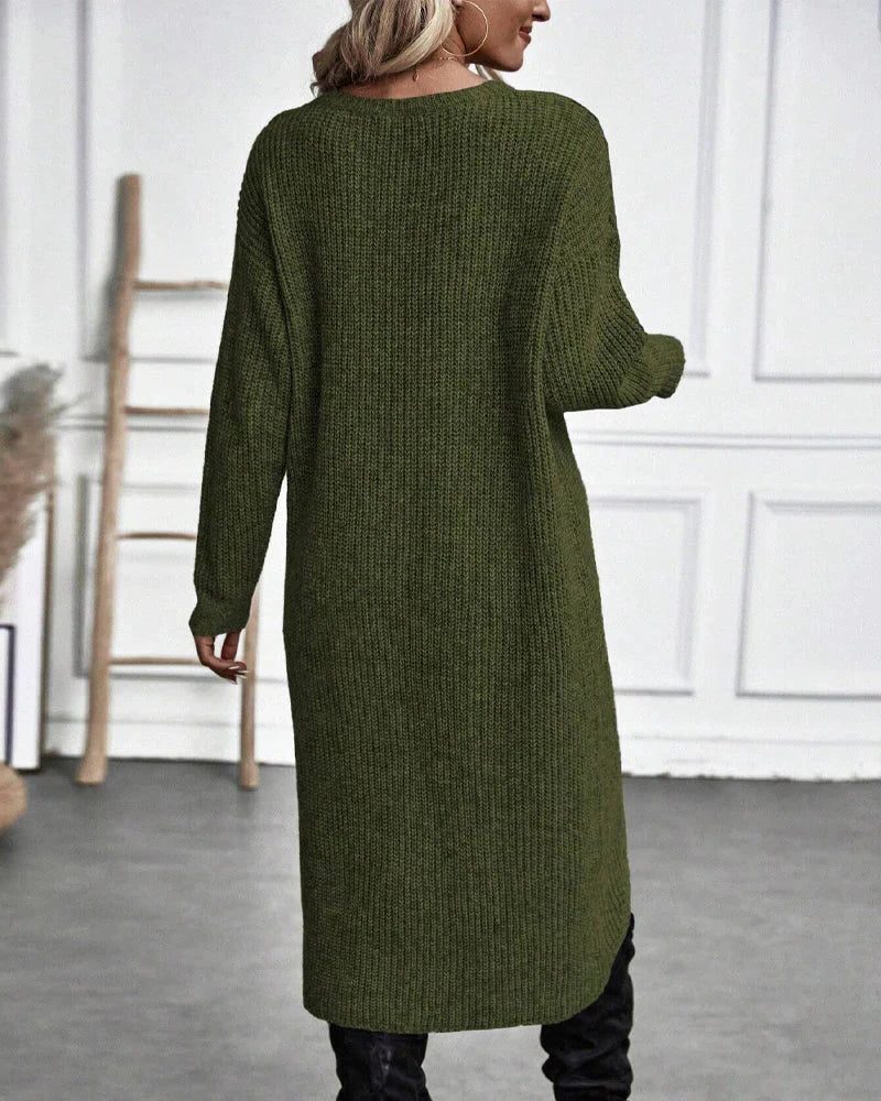 Woman wearing a ribbed knit midi sweater dress with a wrap front and split hem, styled with leggings and knee high boots - view 3