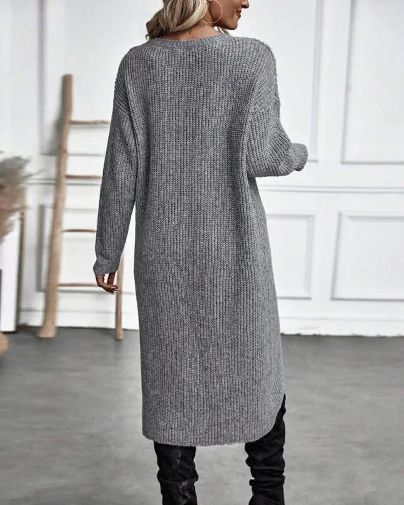 Woman wearing a ribbed knit midi sweater dress with a wrap front and split hem, styled with leggings and knee high boots - view 5