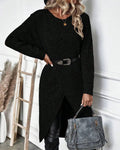 Woman wearing a ribbed knit midi sweater dress with a wrap front and split hem, styled with leggings and knee high boots - view 6