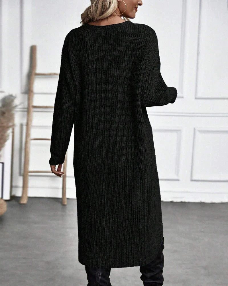 Woman wearing a ribbed knit midi sweater dress with a wrap front and split hem, styled with leggings and knee high boots - view 7