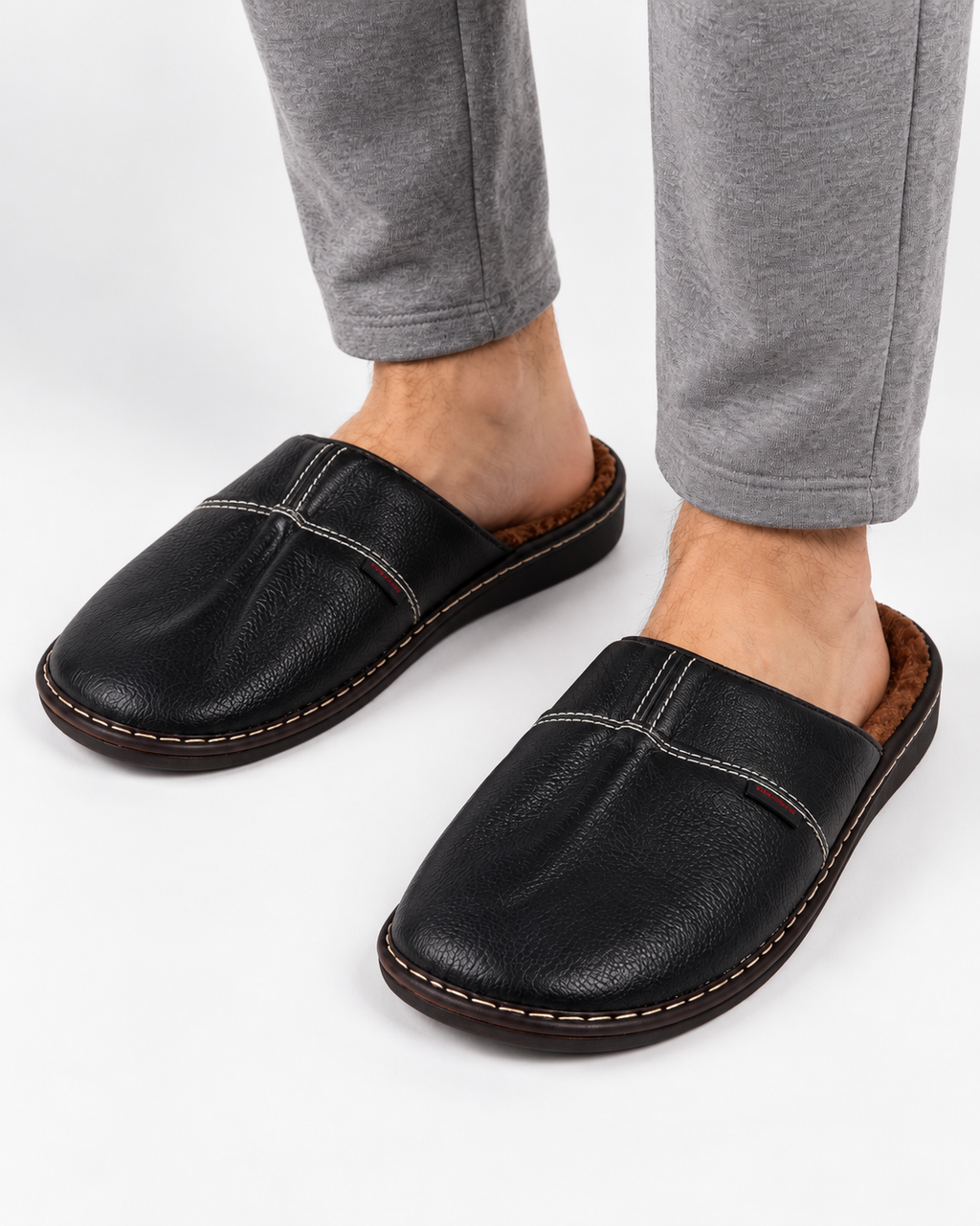 Plush lined mens house slippers in a mule style with contrast stitching
