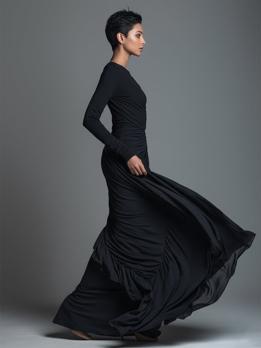Woman in a black long sleeve knit maxi dress with ruched waist - view 5