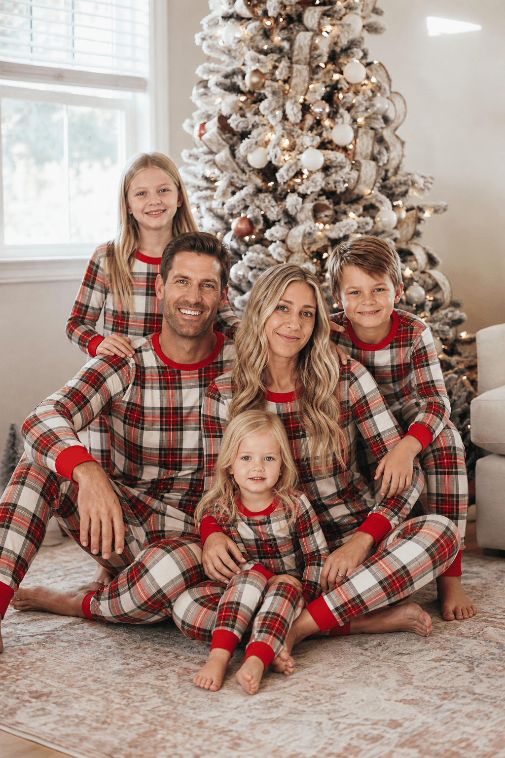 Family wearing matching cream and red tartan Christmas pyjamas with red ribbed cuffs - view 15