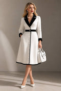 White notched lapel long sleeve midi dress with black trim and enamel buttons