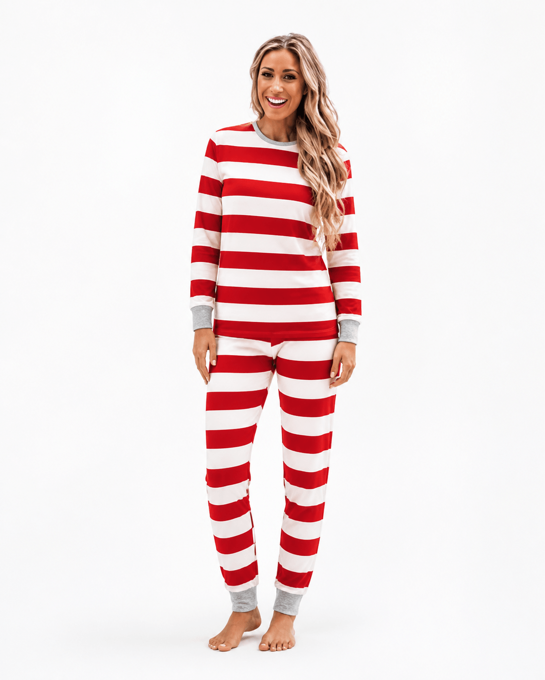 Family wearing matching red and white candy cane stripe Christmas pyjamas with grey ribbed trims - view 8
