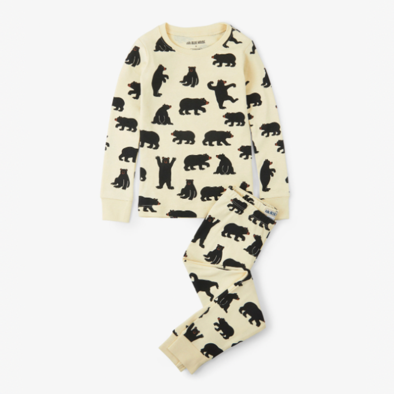 Men's bear print Christmas pajamas with black long-sleeve top by a fireplace - view 8