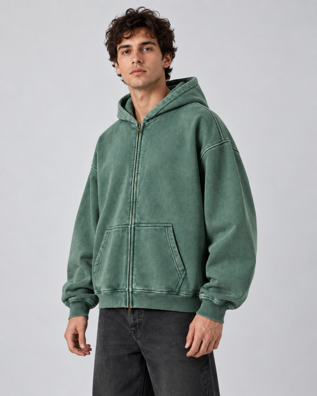 Man wearing an oversized washed zip up hoodie with kangaroo pocket and ribbed cuffs - view 3